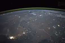 The winding border between Pakistan and India is lit by security lights. It is one of the few places on Earth where an international boundary can be seen at night.