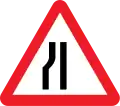 Road narrows on left side