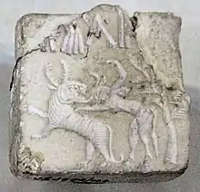 Fighting scene between a beast and a man with horns, hooves and a tail, who has been compared to the Mesopotamian bull-man Enkidu. Indus Valley civilization seal.