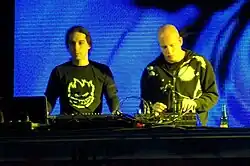 Infected Mushroom playing at a DJ booth