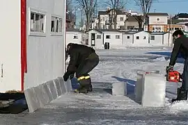 Resurfacing a cabin with ice, which will be covered with snow