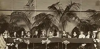 Image of a group of women seated on a dais