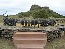 Image 9The monument to the Battle of Isandlwana depicts a beaded Zulu necklace similar to the one used for the original Wood Badge beads (from Wood Badge)