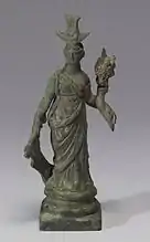 Metal figurine of a woman