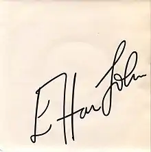 white (fading?) sleeve with Elton John's signature