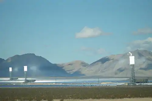 Image 6Ivanpah Solar Electric Generating System with all three towers under load during February 2014, with the Clark Mountain Range seen in the distance (from Solar power)