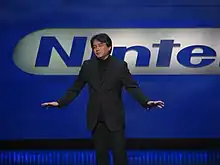 Satoru Iwata giving a presentation.