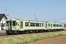 A two-car KiHa 110 series train on the Koumi Line, April 2008