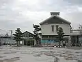 The JR station is the smaller building to the left. The larger building on the right which matches the Matsuura station design is used by another company.