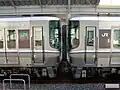 A 223-5000 series (left) coupled with a JR Shikoku 5000 series (right)