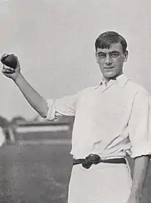 A cricketer holding a cricket ball