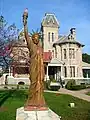 Statue of Liberty replica in front of the mansion