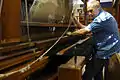 Weaving on a jacquard loom with a flying shuttle at the Textile Department of the Strzemiński Academy of Fine Arts in Łódź, Poland.