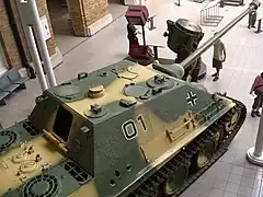 Jagdpanther equipped with the Nahverteidigungswaffe on the upper left side of the roof. Center left side of the roof.