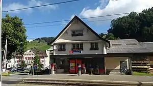 Three-story building with gabled roof