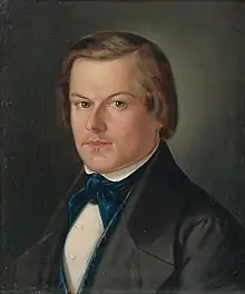 A painted portrait of a blond man in a suit with a blue velvet tie.