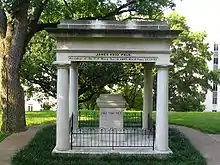 A marble tomb, with four columns supporting a roof