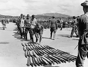 Japanese officers surrender swords to 25th Division in Kuala Lumpur