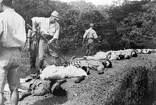 Captured soldiers of the British Indian Army executed by the Japanese.