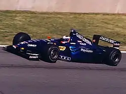 Jarno Trulli driving the Prost AP02 at the 1999 Canadian GP