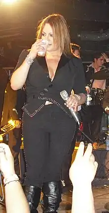 Jenni Rivera taking a break during a performance