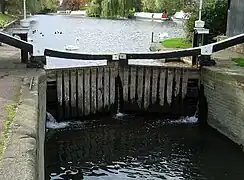 Top gate of a lock, showing the balance beams and paddle winding gear