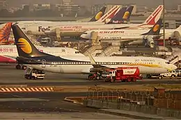 Many jet planes at a terminal