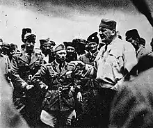 a black and white photograph of a group of Italian officers and Chetniks