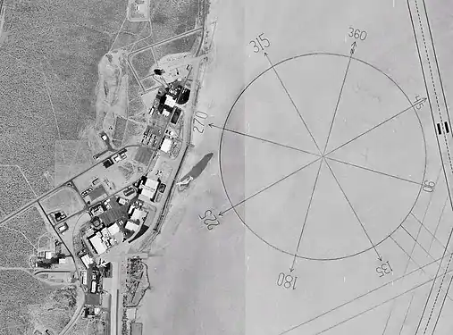 The world's largest compass rose, drawn on the desert floor at Edwards Air Force Base in California, United States. Painted on the playa near Dryden Flight Research Center, it is inclined to magnetic north and is used by pilots for calibrating heading indicators. (Credit: NASA.)