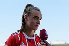 A woman in a football kit