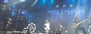 Jinjer performing in 2019 (L–R: Ibramkhalilov, Shmailyuk, Ulasevich, Abdukhanov)