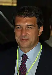 suntanned man in business suit with smiling happily