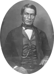 Hawaiian man in western Victorian formal suit