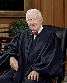 John Paul Stevens, seated