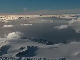 The Spanish base area from Mount Friesland, with Napier Peak and Johnsons Glacier in the foreground, Charrúa Ridge on the right and Mount Reina Sofia in the background, and South Bay, Hannah Point and western Livingston Island farther away