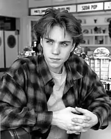 Image 81Jonathan Brandis in a Grunge-style flannel shirt and curtained hair in 1993 (from 1990s in fashion)