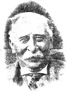 A black-and-white photo of Joseph Whitaker looking forwards