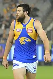 Male athlete in an Australian rules football game