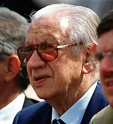 a head shot of Juan Antonio Samaranch with dark glasses on