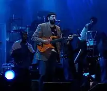 Image 2Dominican singer/songwriter Juan Luis Guerra in concert, 2005 (from Culture of the Dominican Republic)