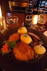 Judd mat Gaardebounen served with boiled potatoes and Diekirch beer