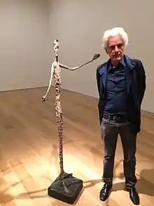 Judd Tully with the hand-painted Alberto Giacometti bronze, "Pointing Man" from 1947 at Christie's New York 2015.