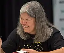 Kagawa autographing a book at BookExpo America in 2018