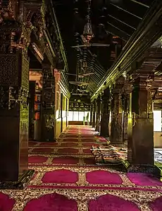 The exquisite wood carvings in the pillars of the mosque