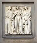 Justice is redundant as all crime is conquered; Virtue on the left passes to Justice the palm of victory and takes the sword. Justice passes the scales of justice to Concord.