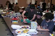 Students building at their pit tables during the 2009 World Championships.