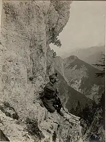 B&W photo of soldier on a mountain