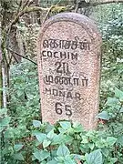 Kilometers/Miles marker on Munnar Road at Km 16, 2008