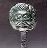 Pin with miniature head sculpture