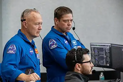 Demo-2 astronauts Doug Hurley and Bob Behnken observe the test